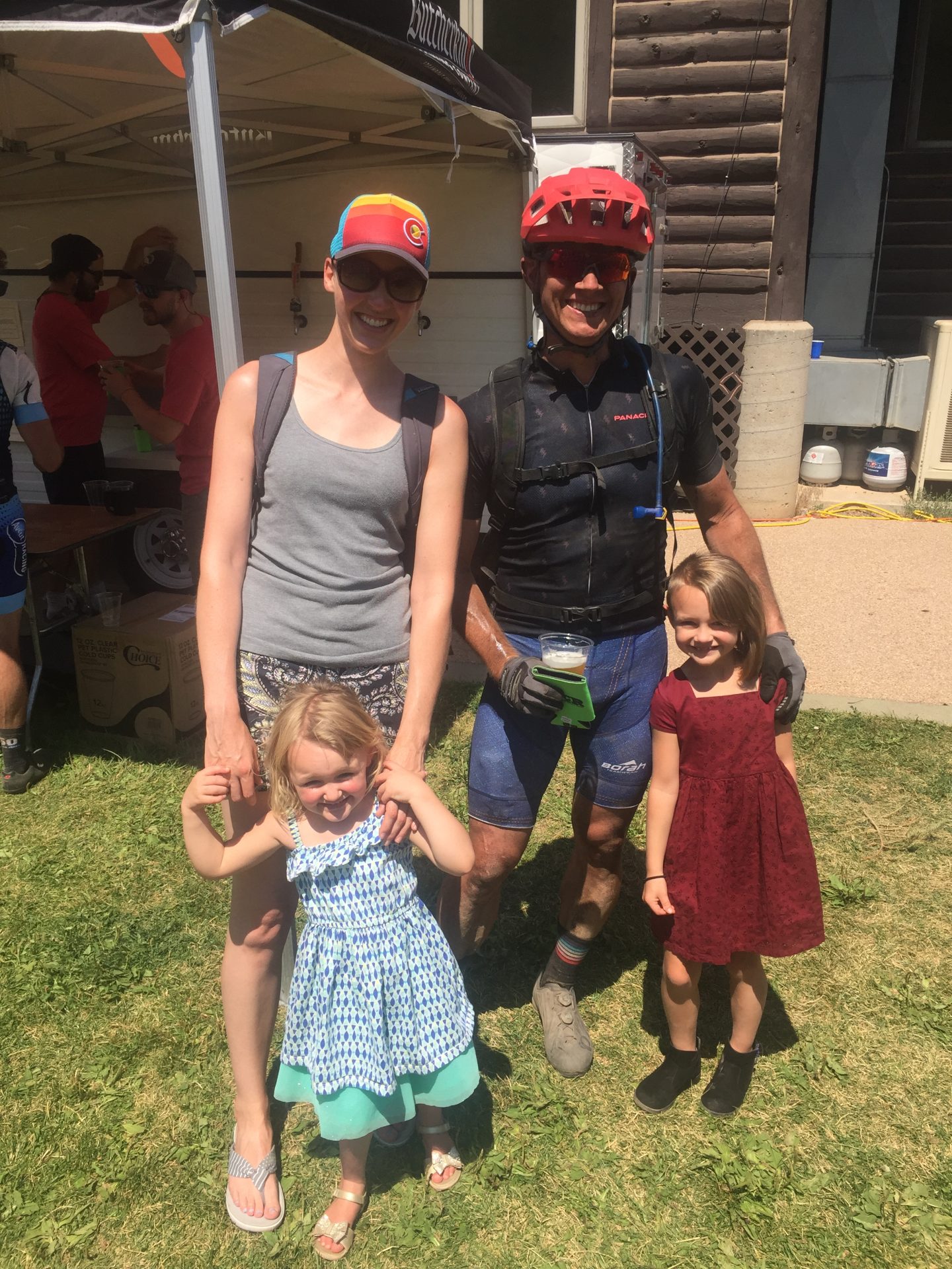 Left Hand Chiropractic doctors with their children at a community event, representing family-centered and community-focused care
