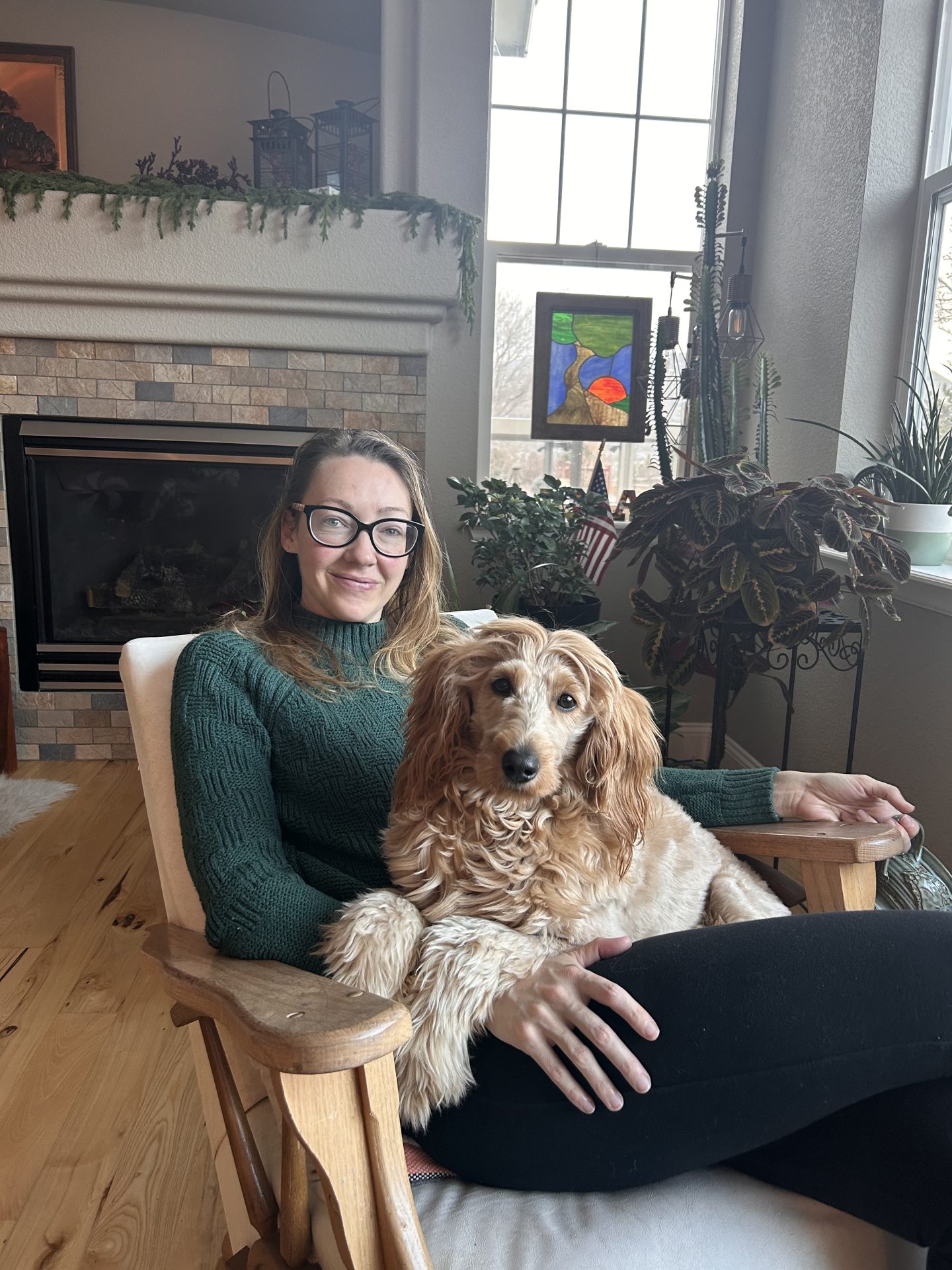 Dr. Christine Illman with her dog on her lap.